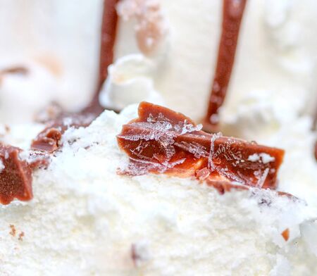 Picture of a chocolate ice cream texture with pieces of chocolate and iceの写真素材