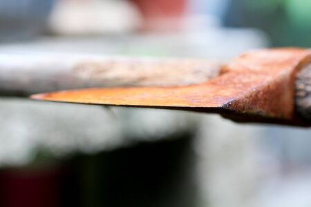 picture of an old rusty oxidated chopping axeの写真素材