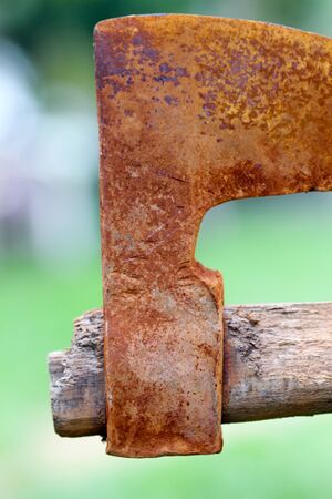 picture of an old rusty oxidated chopping axeの写真素材