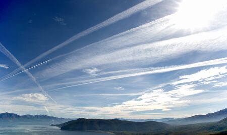 Chemtrails on the sky, Lake Prespa in Macedoniaの写真素材