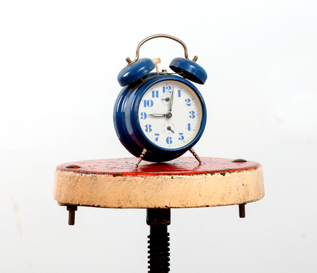 picture of a blue alarm clock on a white backgroundの写真素材