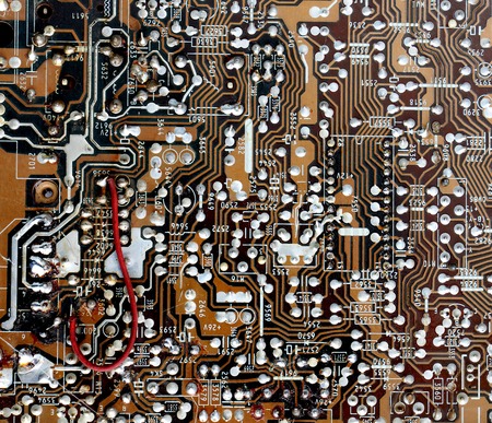 Part of old vintage printed circuit board with electronic components.の写真素材