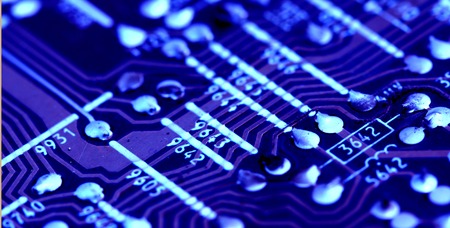 Part of old vintage printed circuit board with electronic components.