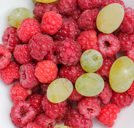 picture of a Raspberry and grape fruits, red , green and ripeの写真素材