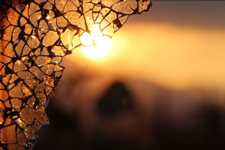 picture of a broken car glass on sunsetの写真素材