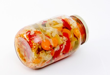Mixed pickled vegetables in glass jarの写真素材