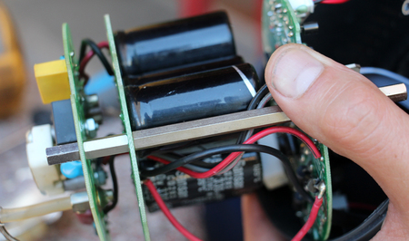 picture of a Hands of male fixing electronic device,studio photo flash