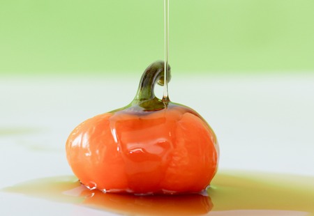 picture of a oily orange chili bell peppers,studio shotの写真素材