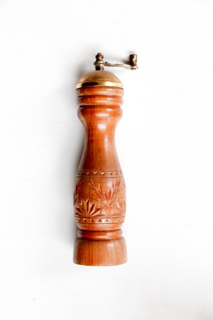 old pepper mill on whiteの写真素材