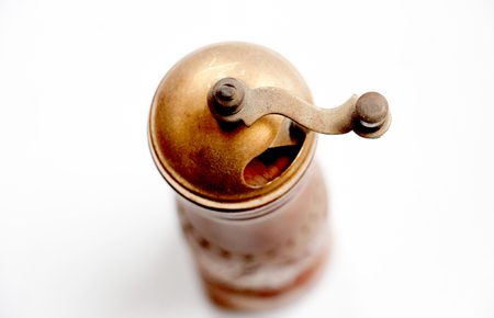 old pepper mill on whiteの写真素材