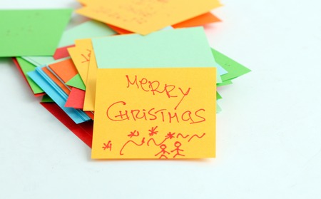 picture of a Note papers on white background,merry xmas text