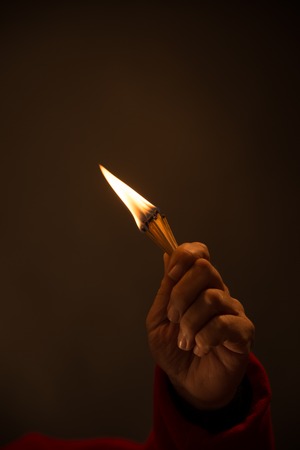 picture of a hand holding Burning Matches. studio shot,close up,の写真素材