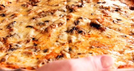 picture of a Fresh baked pizza in macro viewの写真素材