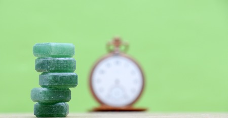 picture of a Green mints candy on green background.の写真素材