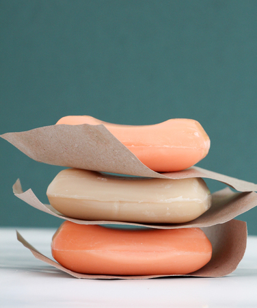 picture of a three bars of soap with peach and cocoa aroma
