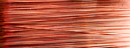 picture of a detail of a copper inductor in a transformer. macro shot in studio