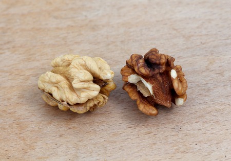 picture of a organic walnuts on a wood background