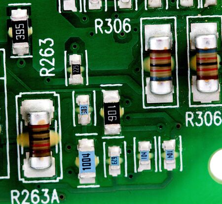 Detail of an electronic printed circuit board with many electrical components