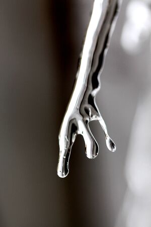 Picture of a Close up abstract of Icicles hanging from roof .の写真素材