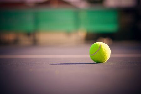 Tennis ball on the court .vignette effect addedの写真素材