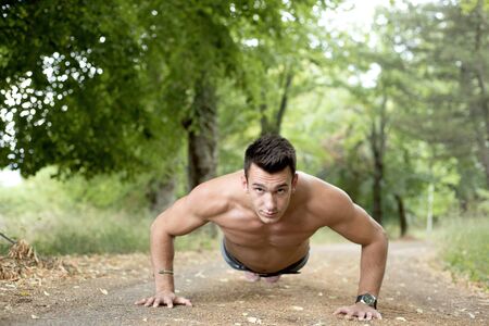 Handsome fit man posing outdoors