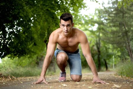 Handsome fit man posing outdoors