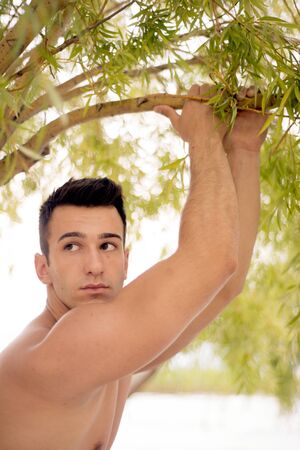 Handsome fit man posing outdoorsの写真素材