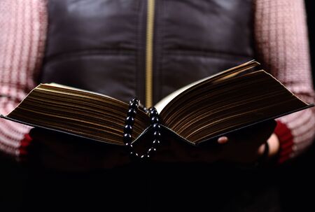 woman holding a book and readingの写真素材
