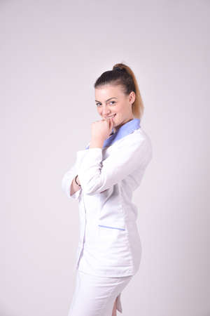 Young nurse portrait on white background,image of aの写真素材