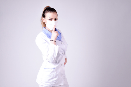 Young nurse gesture silence please,image of aの写真素材