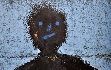 abstract face on cement background,oily wood paint used,image of aの写真素材