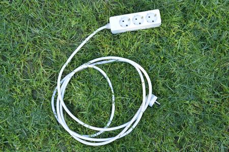 multiple socket on a green grass. green energy concept,imageの写真素材