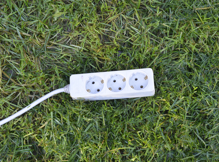 multiple socket on a green grass. green energy concept,imageの写真素材