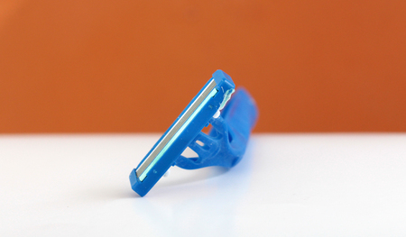 used shaving razor on a white brown background,imageの写真素材