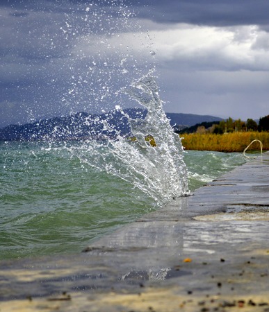 The waves breaking on a concrete embankment on lake ohrid, macedonia,image of a