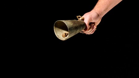 man with livestock bell in a hand,image of aの写真素材
