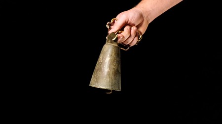 man with livestock bell in a hand,image of aの写真素材