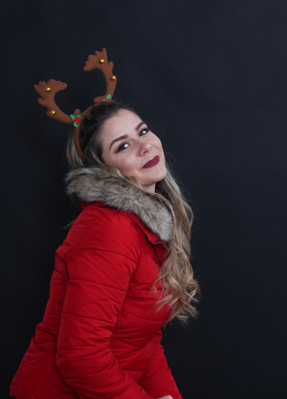 studio portrait of a girl with christmas headband in studio,imageの写真素材