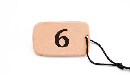 number on , brown ceramic plate ,necklace, on white background