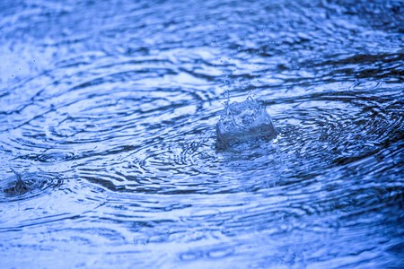 summer raindrops and rippleの写真素材