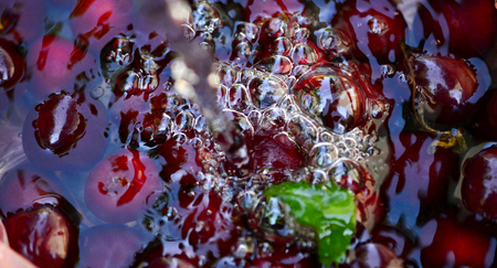 red ripe raw cherries with waterdops,image of aの写真素材