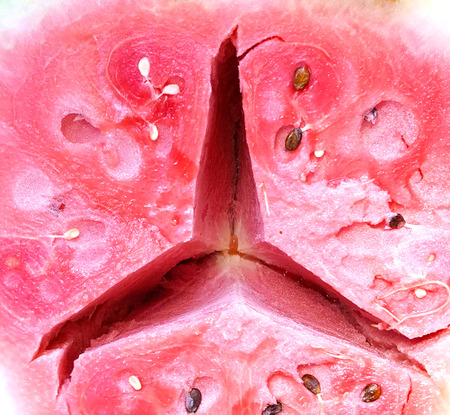 half cut ripe watermelon with sign of a famous carの写真素材