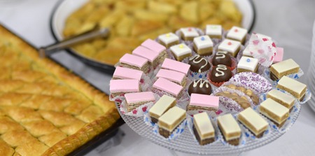 Various sweets and Turkish Dessert Baklava with walnuts on a table,image of aの写真素材