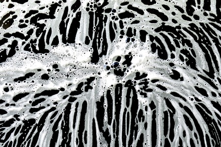 car wash foam patterns on a car window,image of a