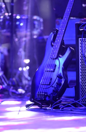 electric bas guitar on a stand in rock concert,imageの写真素材