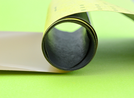 old vintage camera roll film on a green backgroundの写真素材