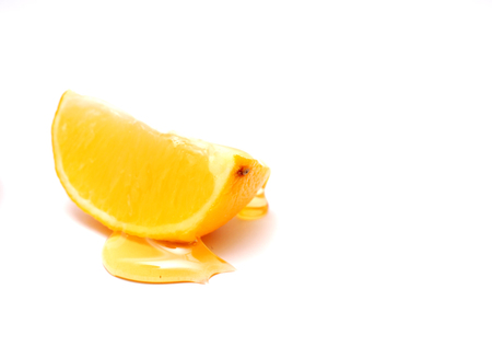 slice of lemon and honey , shallow dof, white background,imageの写真素材