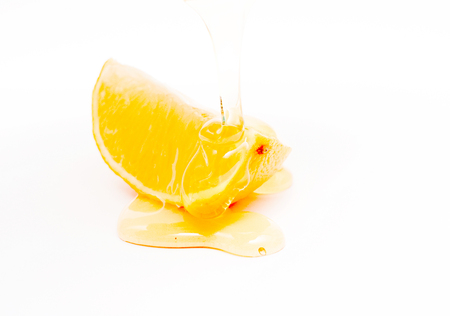 slice of lemon and honey , shallow dof, white background,imageの写真素材