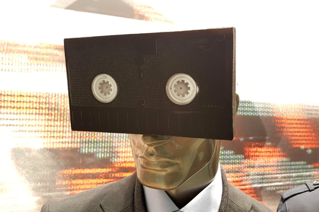 vhs tape on a mannequin doll face, technology concept imageの写真素材