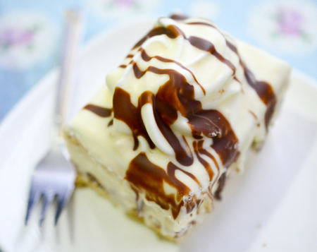 sweet white chocolate cake in a plate, image